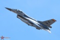 F-16 AM pulling some vapor over the racetrack on departure.